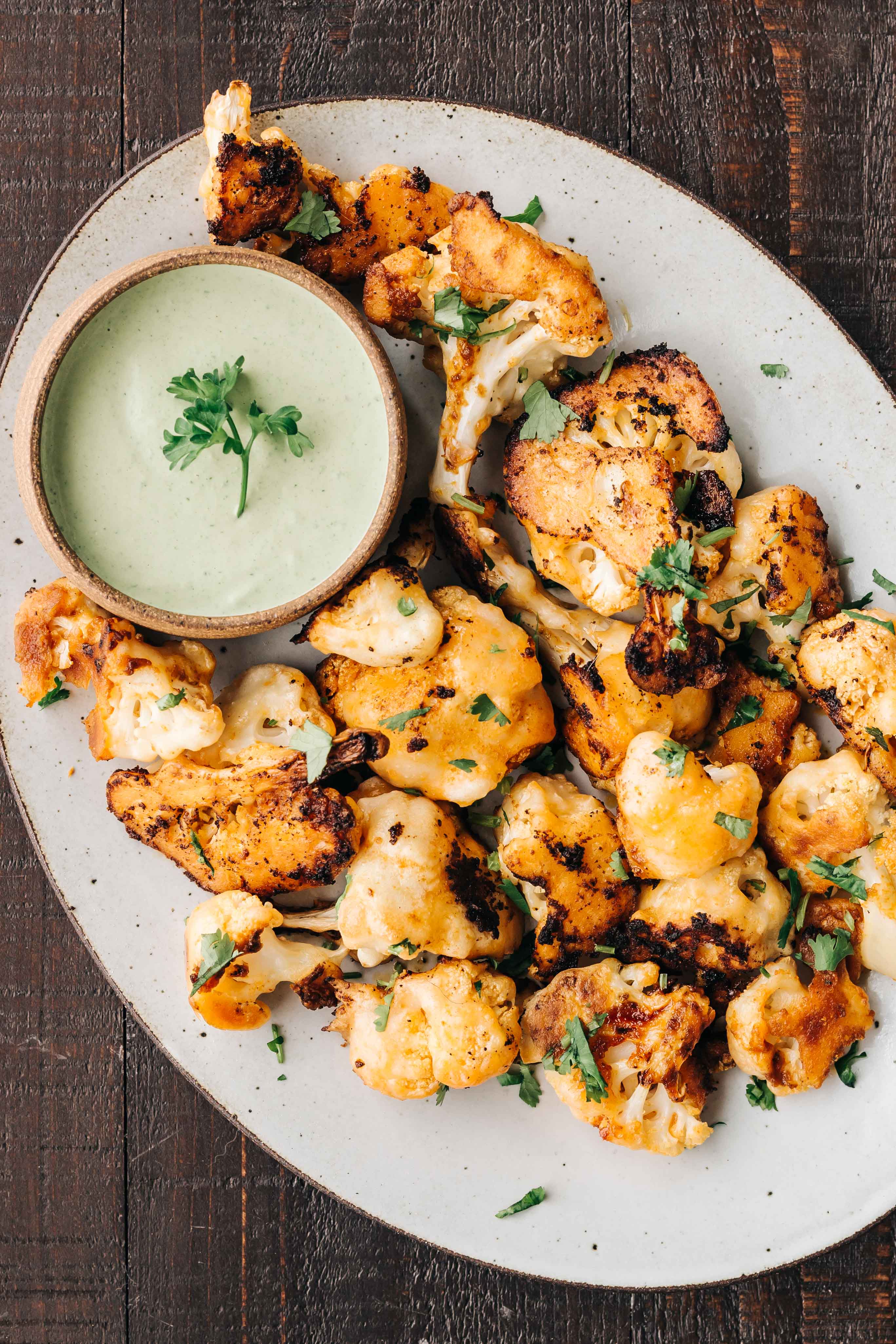 Spicy Buffalo Cauliflower Bites With Herbed Tahini Dip Dishing Up The Dirt