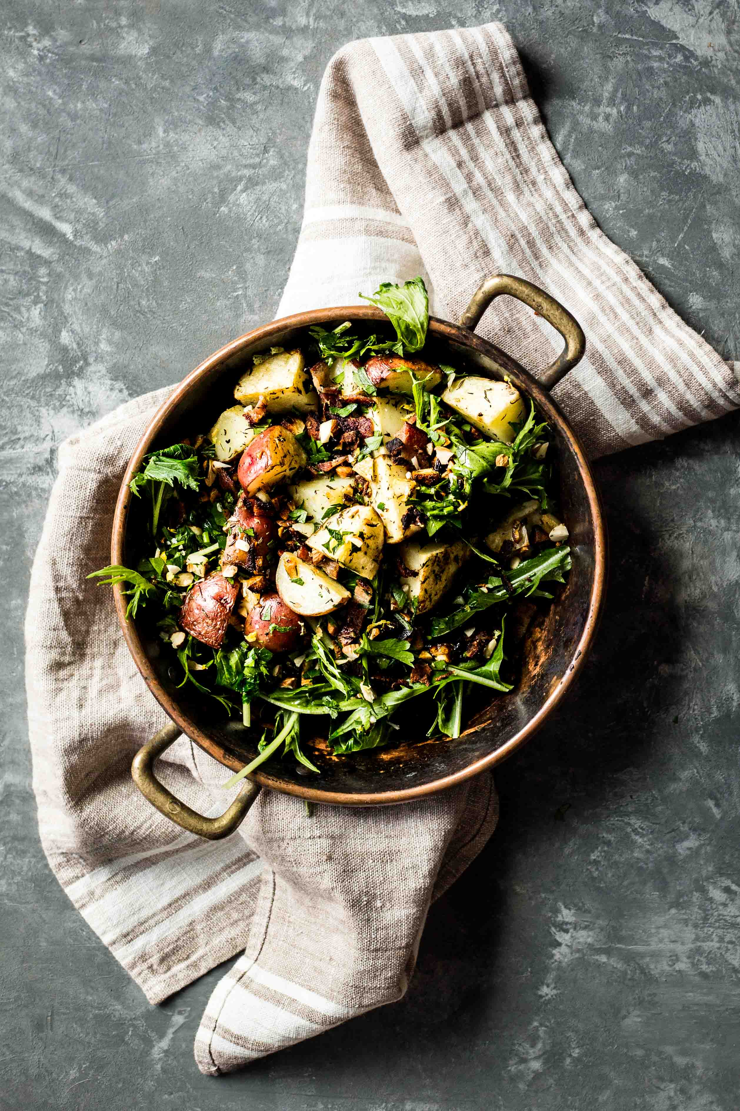 bacon fat crispy potatoes with garlicky kale and lemon-mint crème